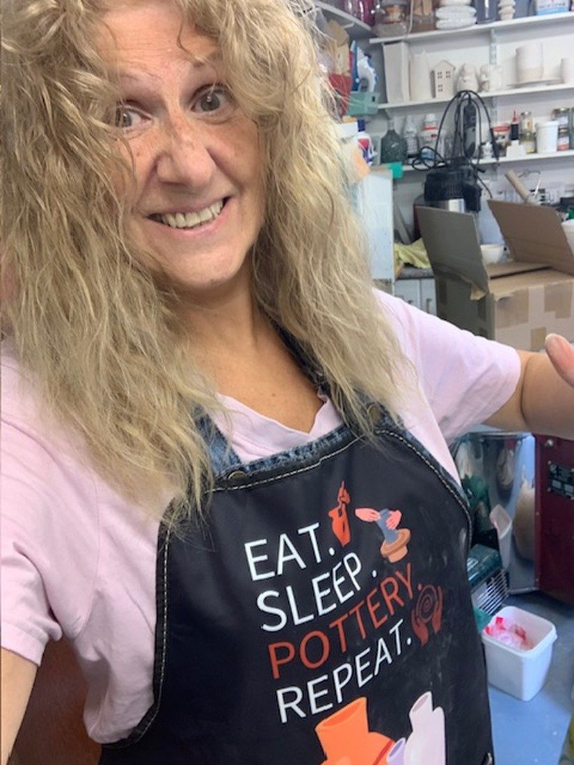 Jacqui in her Eat Sleep Pottery Repeat apron