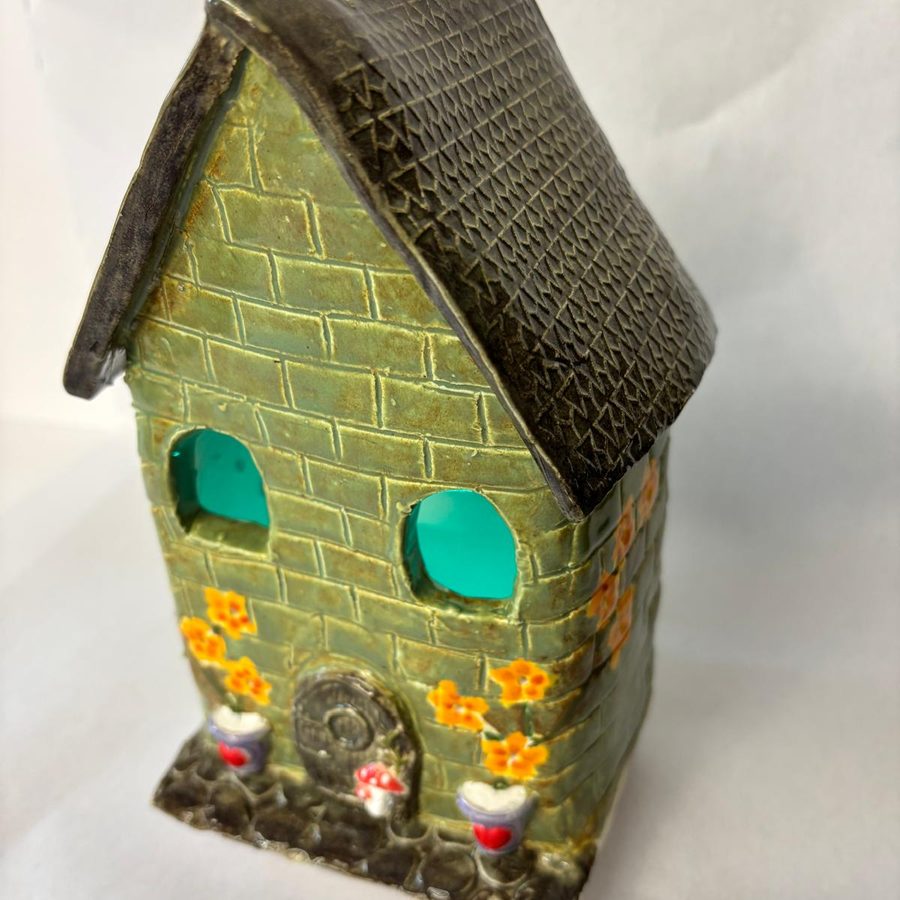 Glazed clay house with a brick texture