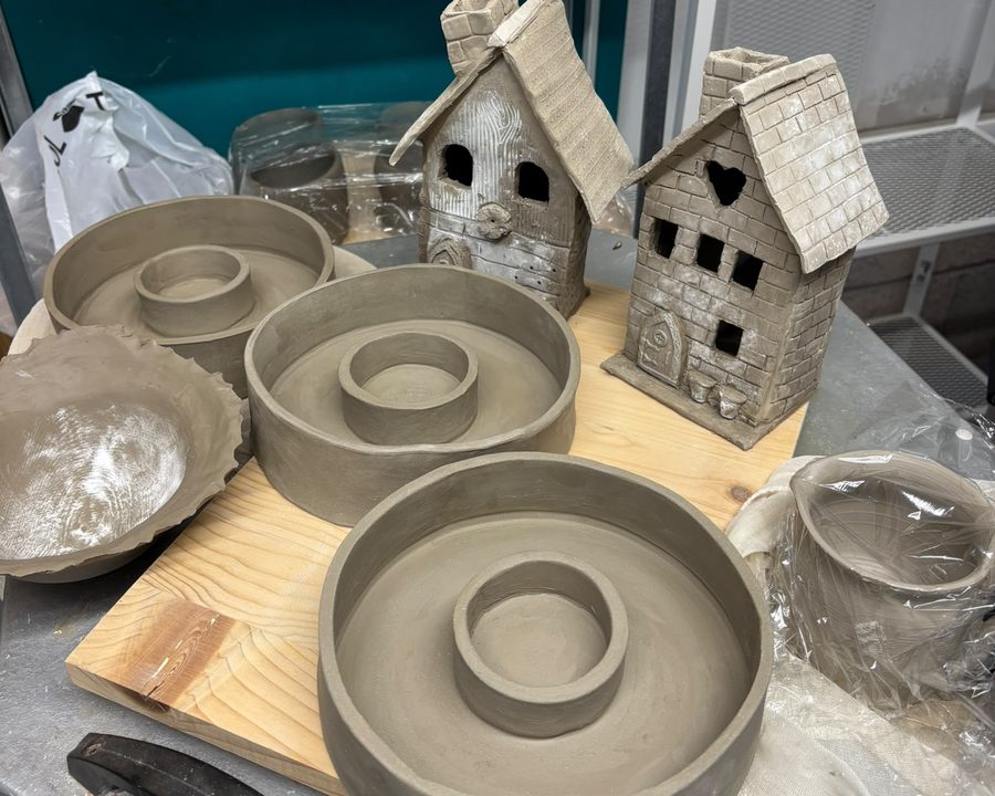 Clay houses and bowls made at Clay Club, waiting for the kiln